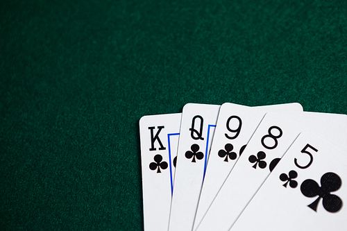 Playing cards arranged on poker table in casino