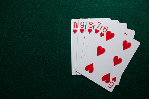 Playing cards arranged on poker table in casino