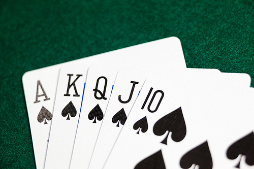 Playing cards arranged on poker table in casino