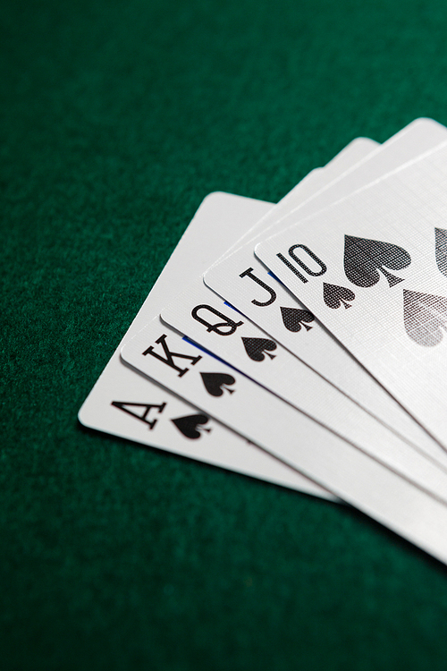 Playing cards arranged on poker table in casino