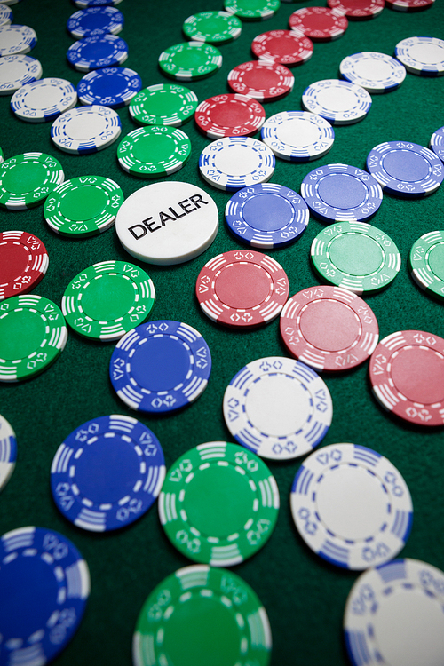 Casino chips arranged on poker table in casino