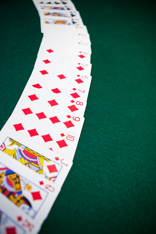 Playing cards arranged on poker table in casino