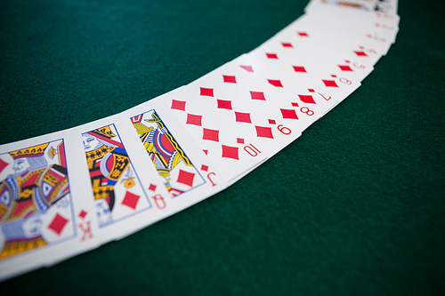 Playing cards arranged on poker table in casino