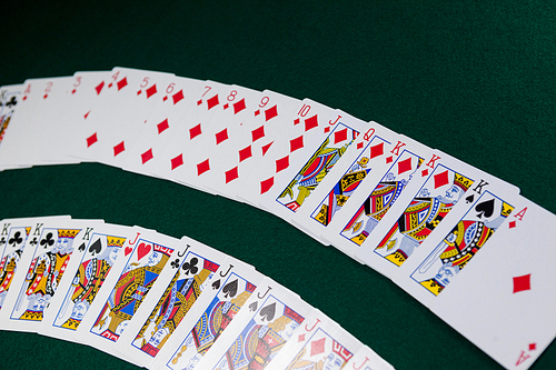 Playing cards arranged on poker table in casino