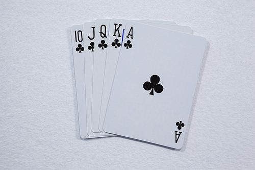 Close-up of playing cards arranged on white background