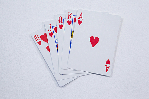 Close-up of playing cards arranged on white background