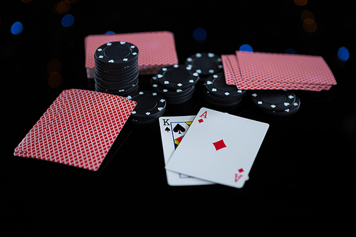 Close-up of chips and cards at casino