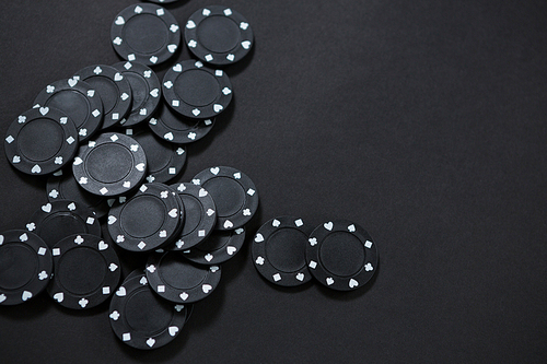 High angle view of black chips on table at casino