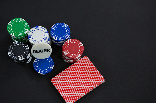 High angle view of cards and chips on table at casino