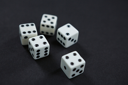 Close-up of white dices on black background