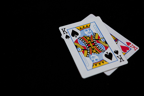 Close-up of king cards on black background