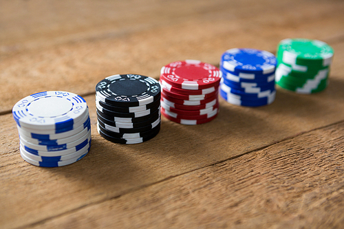 High angle view of chips on wooden table at casino