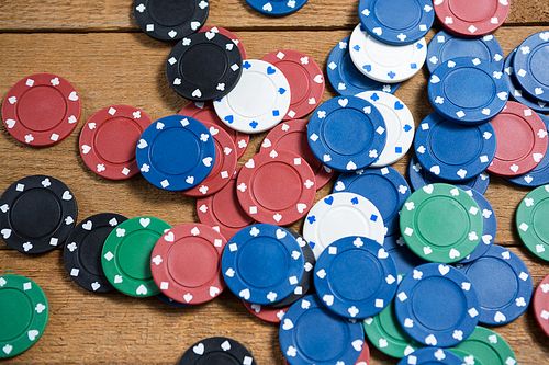 Overhead view of scattered chips on wooden table