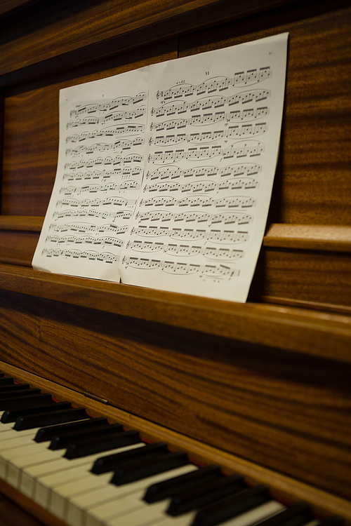 Close up of sheet music on piano in school