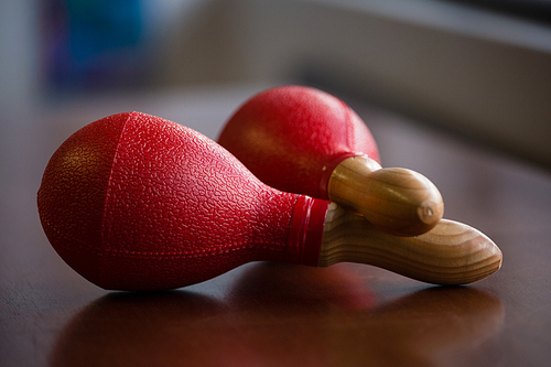 Close up of red maracas on table in classroom