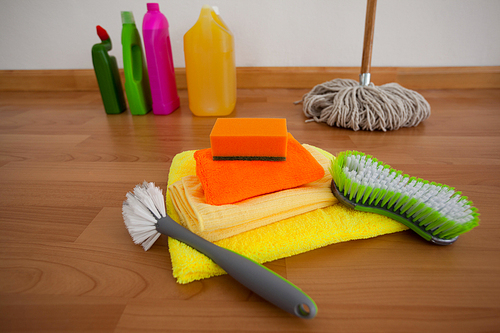 Various cleaning equipment on wooden floor