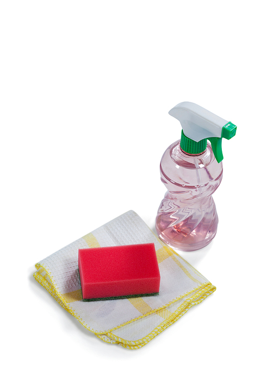 Detergent spray bottle, sponge and cloth on white background
