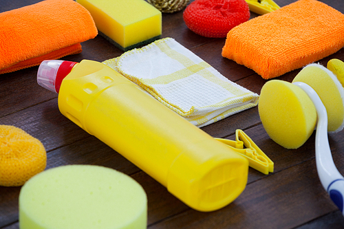 Set of cleaning equipment arranged on wooden floor