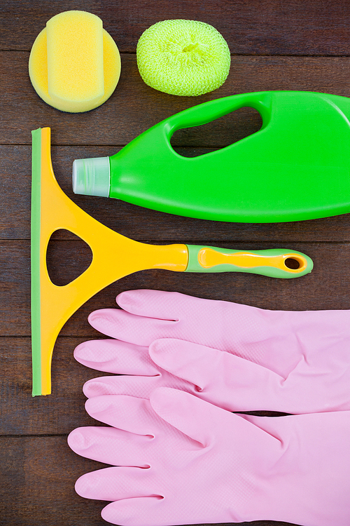 Close-up of cleaning equipment arranged on wooden floor