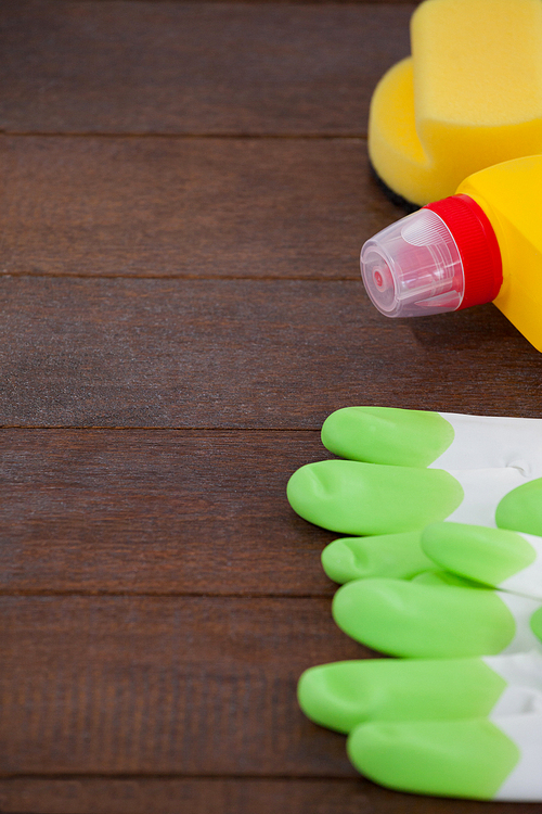 Close-up of cleaning equipment arranged on wooden floor