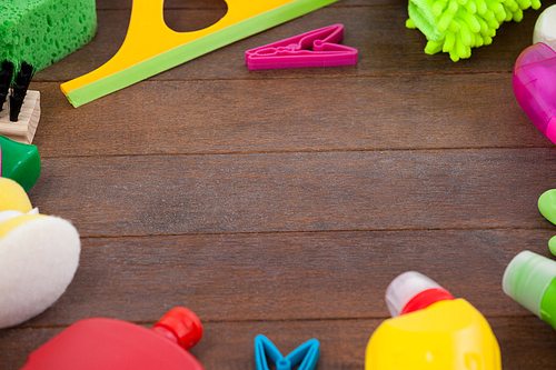 Various cleaning equipments arranged on wooden floor