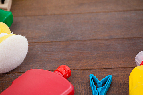 Various cleaning equipments arranged on wooden floor