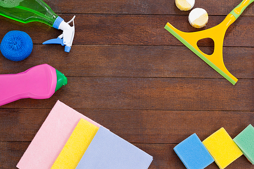 Various cleaning equipments arranged on wooden floor