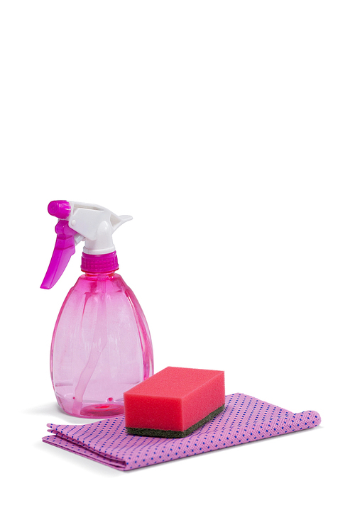 Spray bottle, scouring pad and napkin cloth arranged on white background
