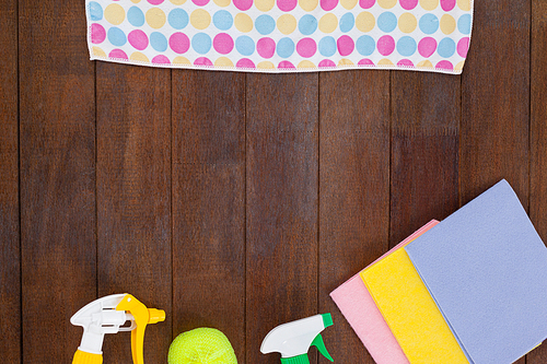 Various cleaning equipments arranged on wooden floor