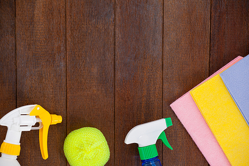 Various cleaning equipments arranged on wooden floor