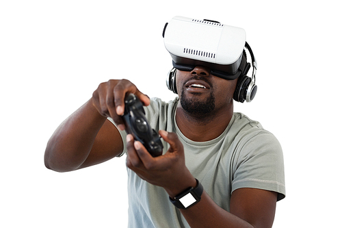 Man using virtual reality headset and playing video game against white background