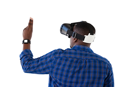 Rear view of man gesturing while using virtual reality headset