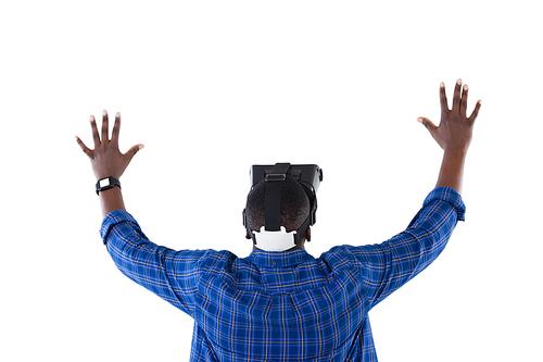 Rear view of man gesturing while using virtual reality headset