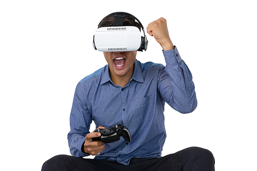 Businessman using vr glasses while playing video game against white background