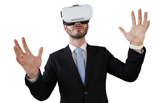 Businessman with vr glasses gesturing while standing against white background