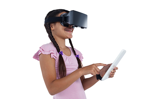 Teenage girl using virtual reality headset and digital tablet against white background