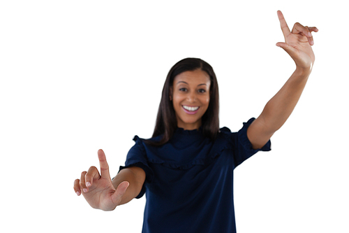 Smiling female executive forming a finger frame against white background