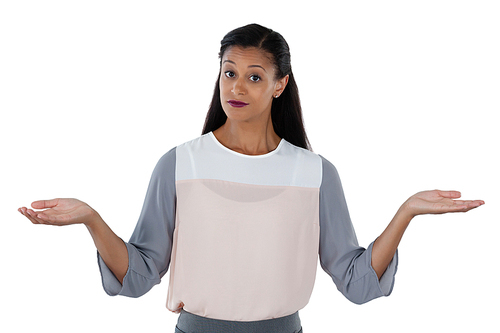 Frowning businesswoman shrugging her shoulders against white background