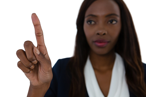 Close up of businesswoman touching imaginary screen against white background