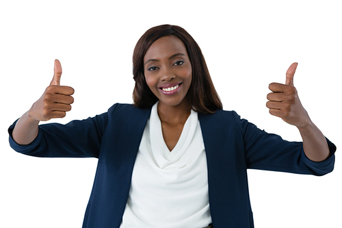 Portrait of happy businesswoman showing thumbs up gesture against white background