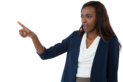Businesswoman pointing while giving presentation against white background