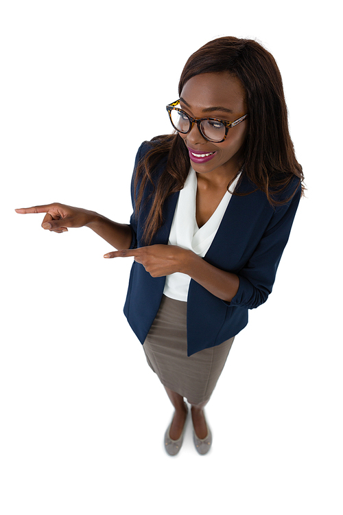 High angle view of smiling businesswoman gesturing while giving presentation against white backgrund