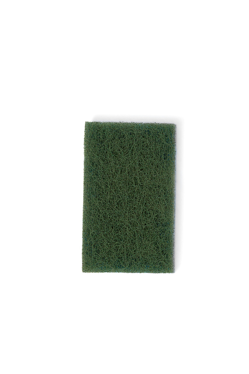 Green scouring pad on white background
