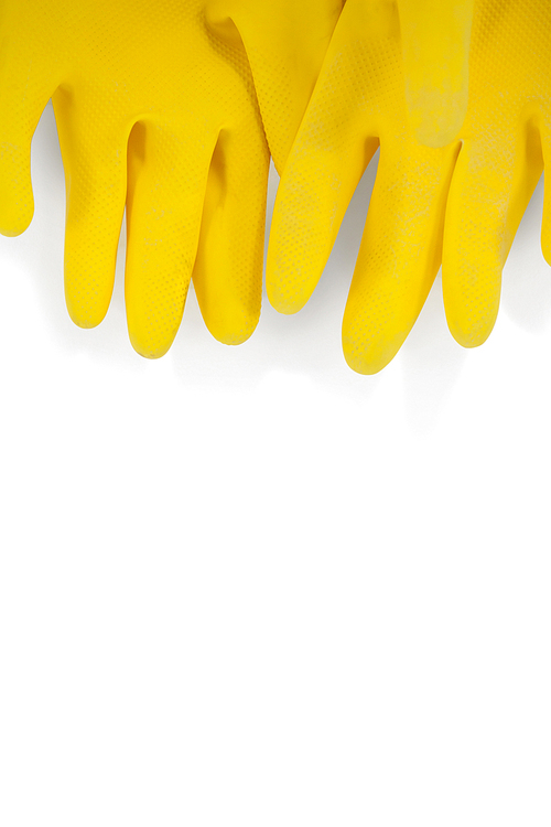 Pair of yellow rubber gloves on white background