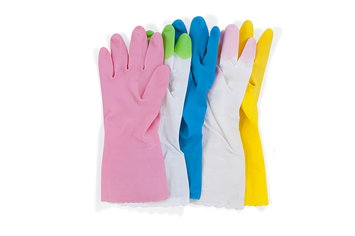 Various colorful rubber gloves on white background