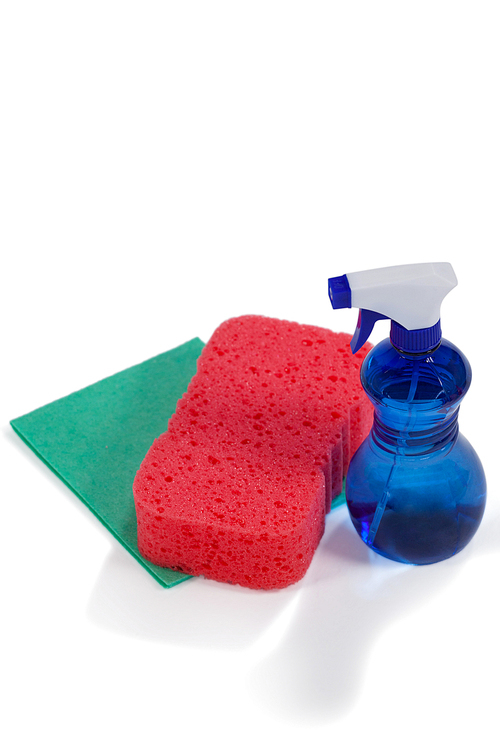 Detergent spry bottle, sponge pad and wipe pad arranged on white background
