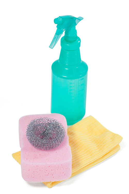 Detergent spray bottle, scrubber, sponge pad and napkin cloth arranged on white background