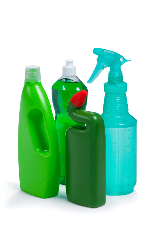 Various detergent bottles arranged on white background
