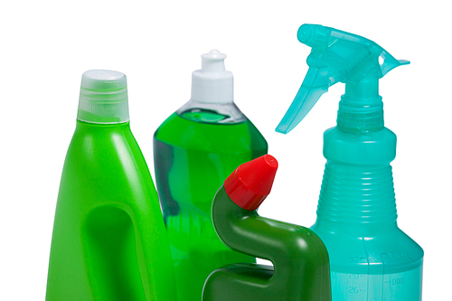Various detergent bottles arranged on white background