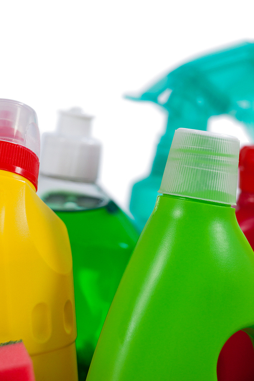 Close-up of various detergent bottles on white background